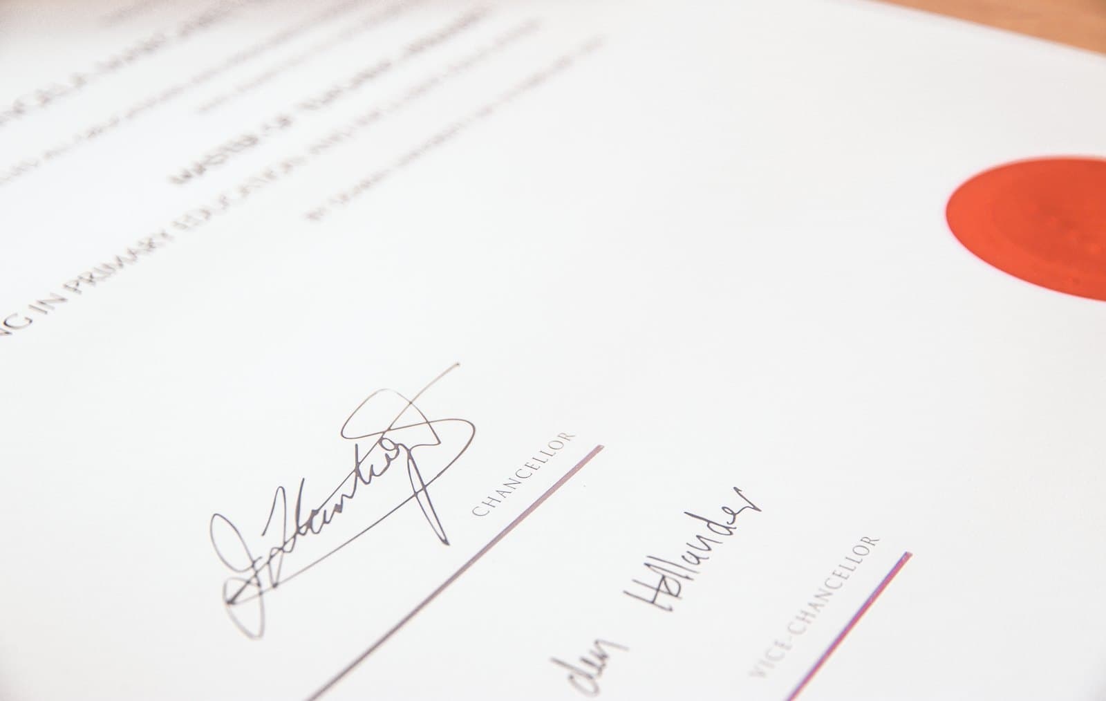 A signed diploma with an embossed seal
