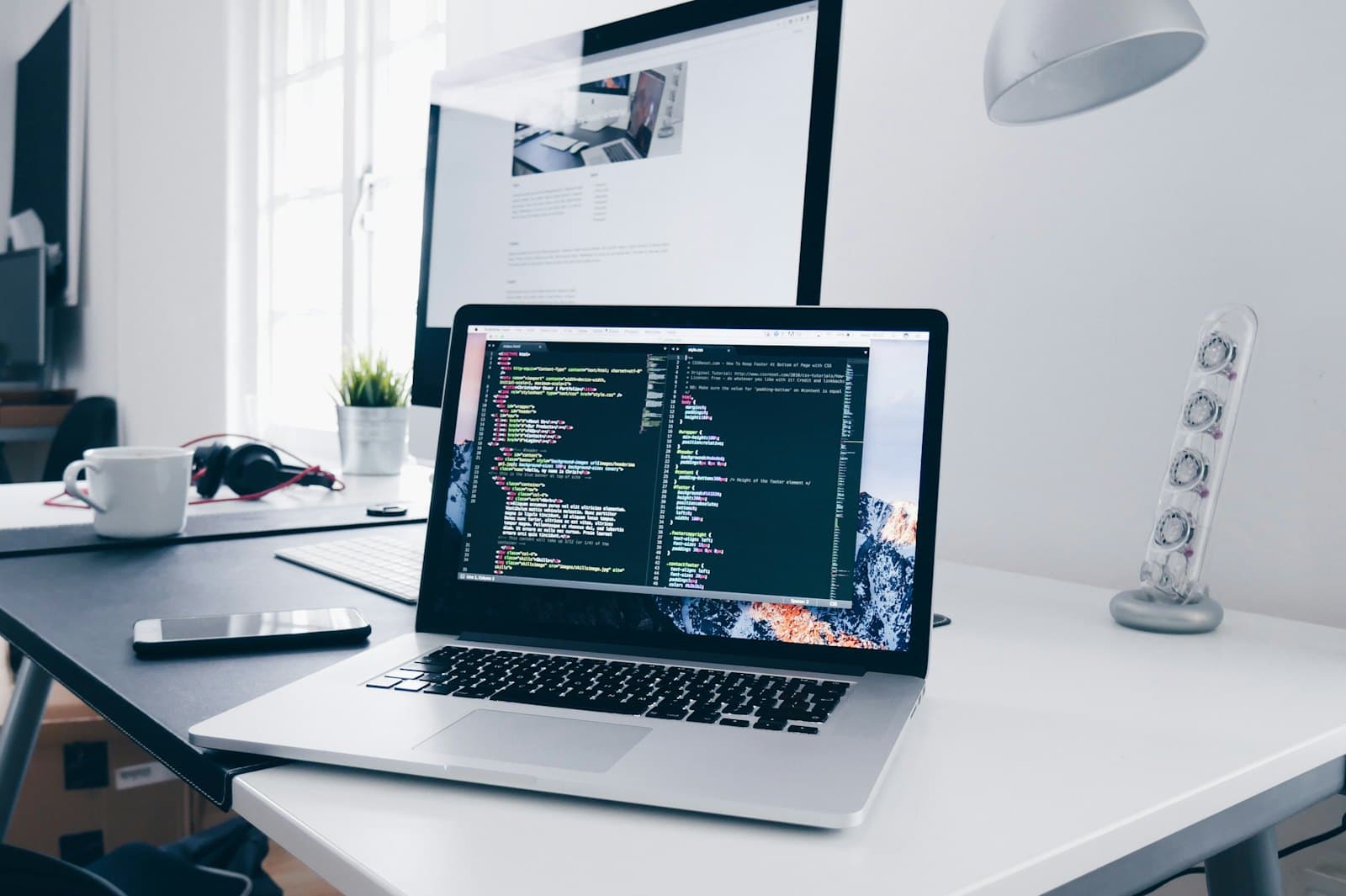A code editor open on a laptop